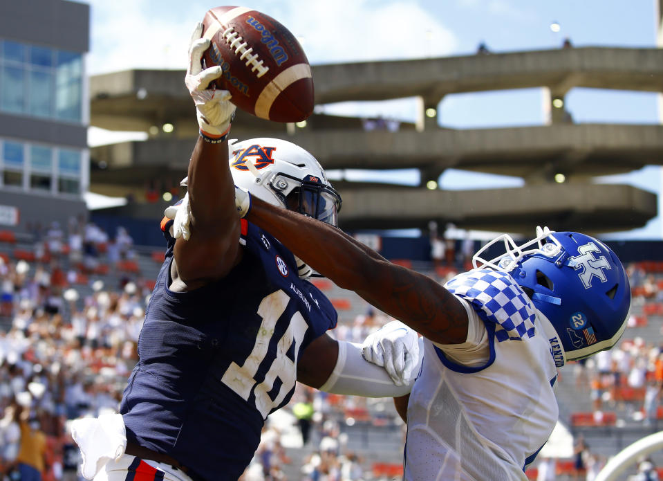 Auburn wide receiver Seth Williams (18) catches a pass for a touchdown over Kentucky defensive back Kelvin Joseph (1) during the fourth quarter of an NCAA college football game on Saturday, Sept. 26, 2020, in Auburn, Ala. (AP Photo/Butch Dill)