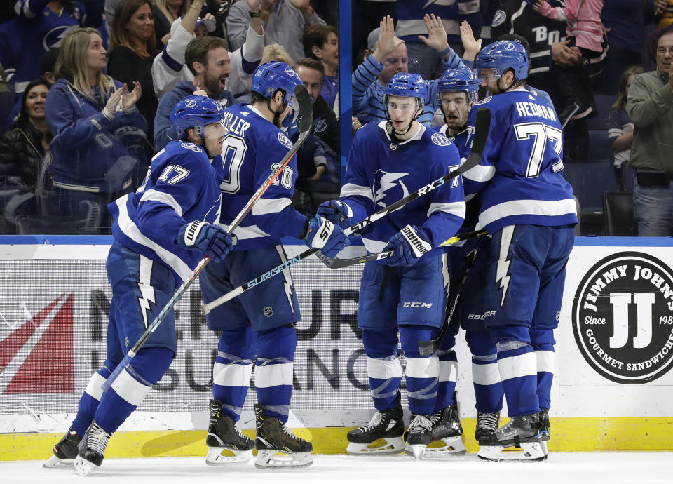 Tampa Bay Lightning left wing Alex Killorn (17) celebrates his goal against the Toronto Maple Leafs with teammates, including center J.T. Miller (10), center Anthony Cirelli (71) and defenseman Victor Hedman (77) during the second period of an NHL hockey game Thursday, Dec. 13, 2018, in Tampa, Fla. (AP Photo/Chris O'Meara)