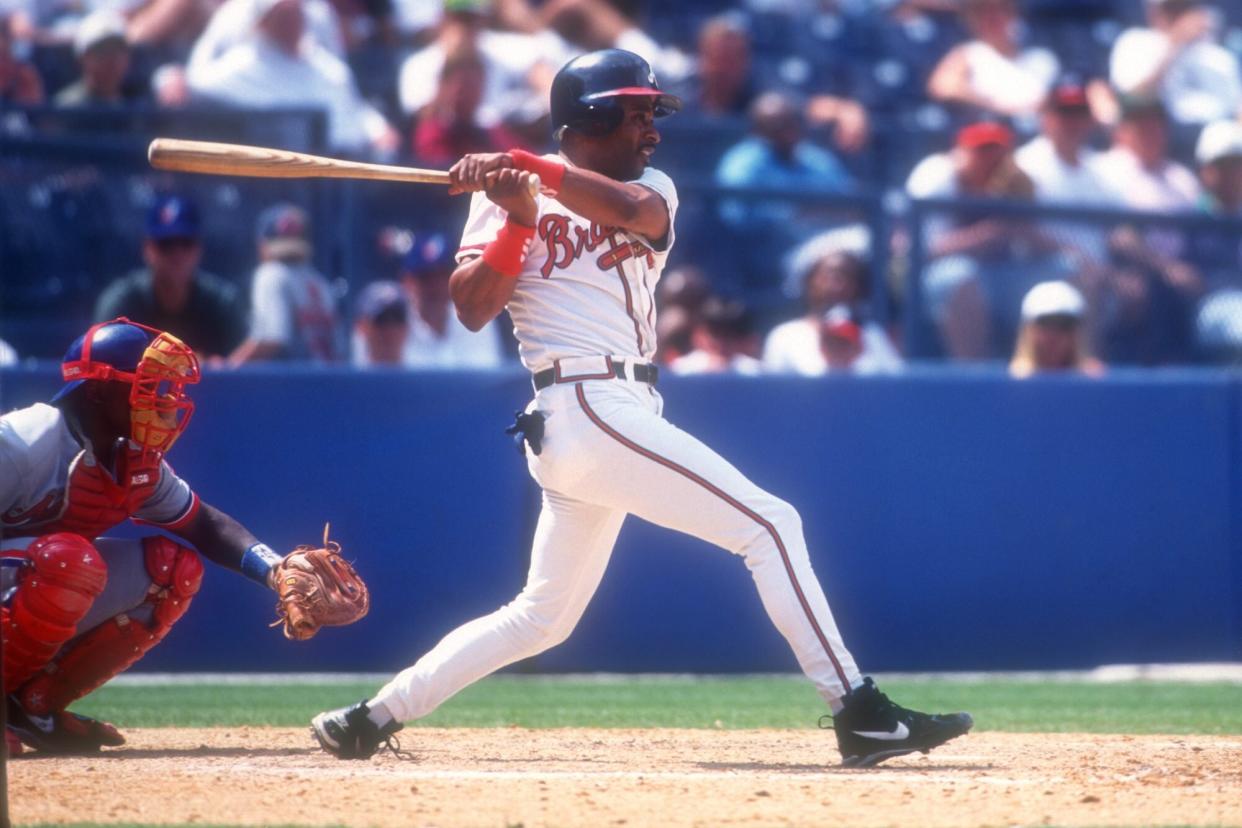 ATLANTA, GA - JULY 16: Dwight Smith #7 of the Atlanta Braves takes a swing during a baseball game against the Montreal Expos on July 16, 1996 at Fulton County Stadium in Atlanta, Georgia. (Photo by Mitchell Layton/Getty Images)