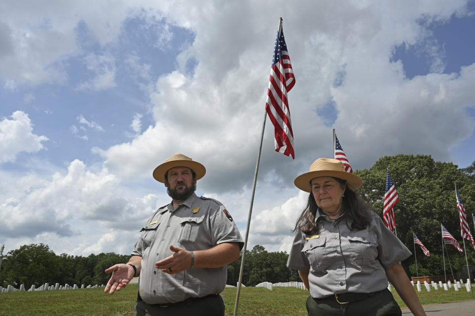 Charles Barr, Cemetery Manager, and Gia Wagner, Superintendent of Andersonville National Historic Site, show Andersonville National Cemetery, Wednesday, May 17, 2023, in Andersonville, Georgia. Army Pfc. Luther Herschel Story was awarded the Medal of Honor after he went missing in battle during the Korean War is being buried on Memorial Day near his hometown in Georgia. Wounded Story was last seen on Sept. 1, 1950, when he stayed behind to cover his infantry unit's retreat. (Hyosub Shin/Atlanta Journal-Constitution via AP)