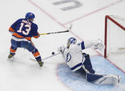 Tampa Bay Lightning goalie Andrei Vasilevskiy (88) makes a save on New York Islanders' Mathew Barzal (13) during the first period of Game 3 of the NHL hockey Eastern Conference final, Friday, Sept. 11, 2020, in Edmonton, Alberta. (Jason Franson/The Canadian Press via AP)