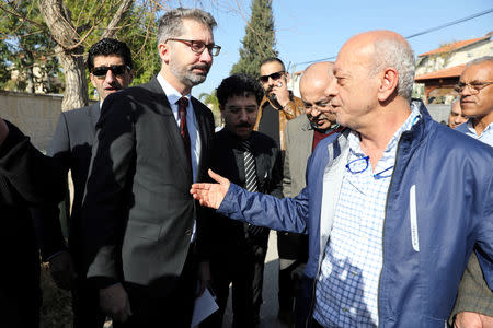 Saeed, father of Aiia Maasarwe, 21, an Israeli student killed in Melbourne, speaks to Australian Ambassador to Israel Chris Cannan (L), during his daughter's funeral in their home town of Baqa Al-Gharbiyye, northern Israel January 23, 2019. REUTERS/Ammar Awad