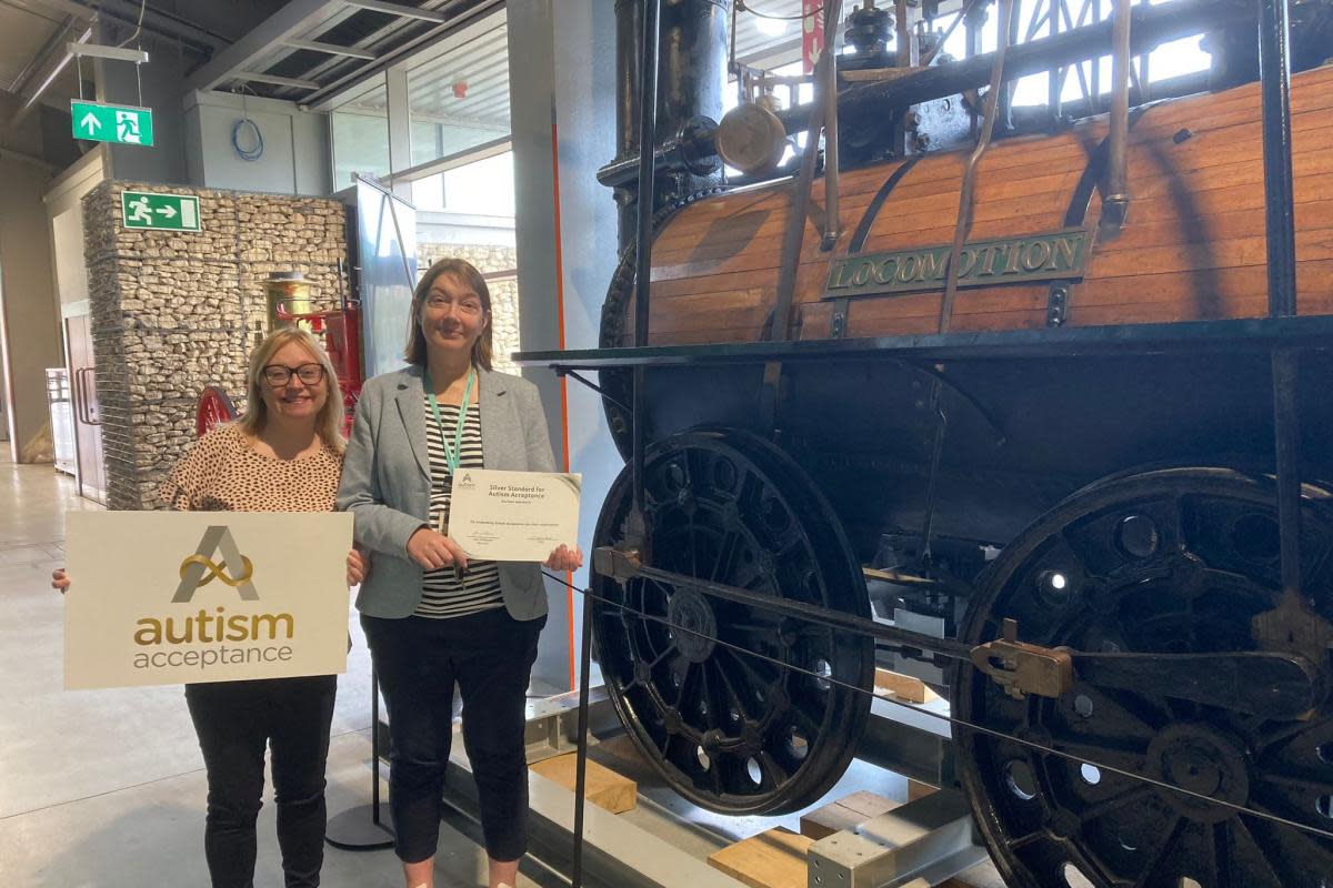 Kerrie Highcock, from the North East Autism Society, presents the award to Pam Porter, from Locomotion <i>(Image: PETER BARRON)</i>