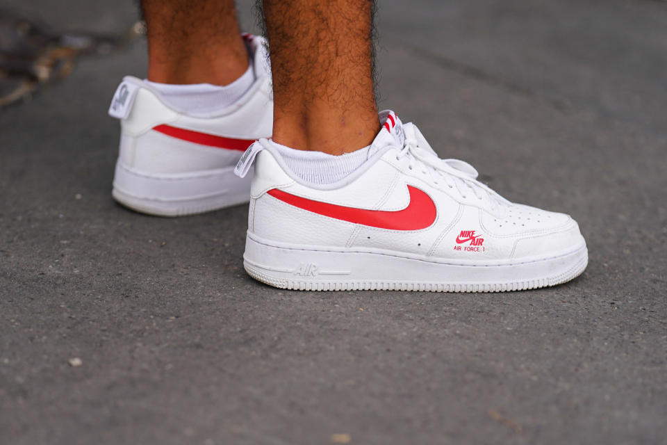 PARIS, FRANCE - JULY 25: A passerby wears white and red Nike Air Force 1 sneakers shoes, on July 25, 2020 in Paris, France. (Photo by Edward Berthelot/Getty Images)