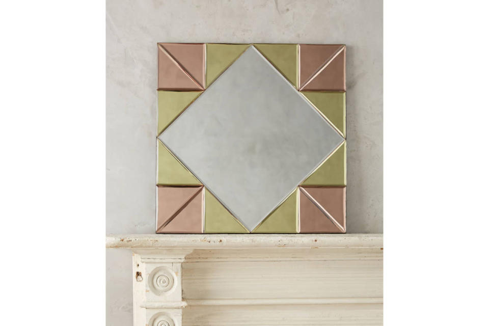 This deco-inspired mirror adds color to any wall it’s on. 