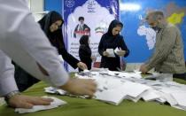 Election officials count ballot papers after the close of polling stations during elections for the parliament and a leadership body called the Assembly of Experts, which has the power to appoint and dismiss the supreme leader, in Tehran February 26, 2016. REUTERS/Raheb Homavandi/TIMA