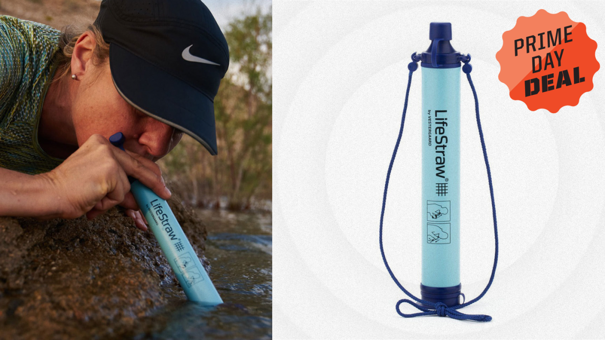 person using lifestraw to drink water from stream