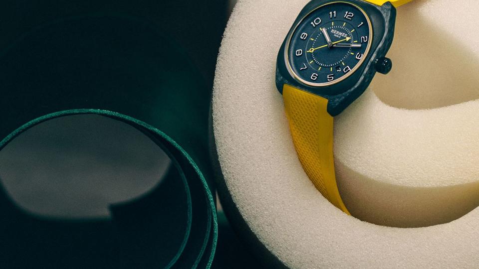 black face watch with yellow band wrapped around foam