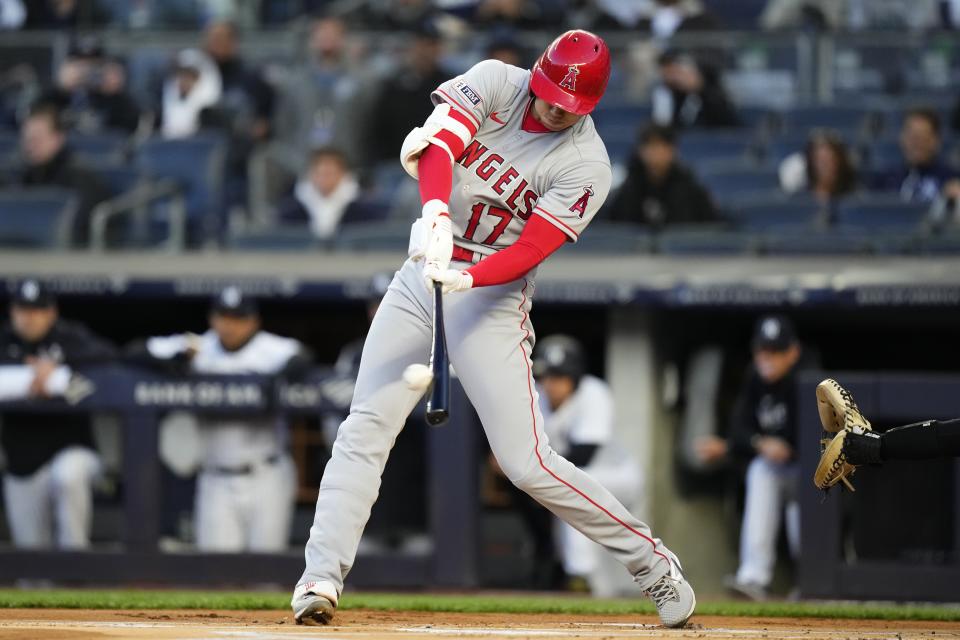 Los Angeles Angels' Shohei Ohtani hits a two-run home run against the New York Yankees during the first inning of a baseball game Tuesday, April 18, 2023, in New York. (AP Photo/Frank Franklin II)