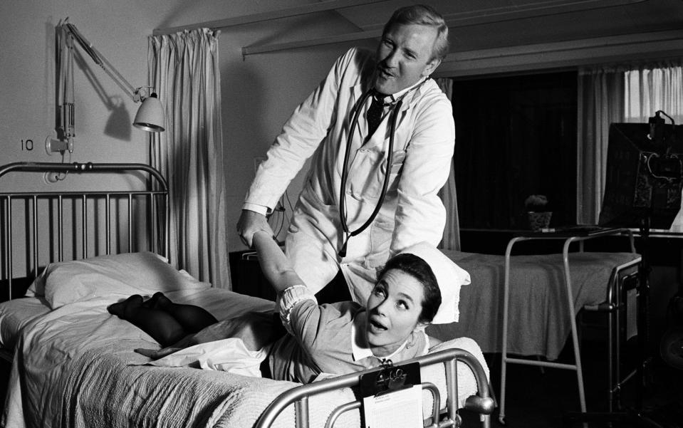 Leslie Phillips and Shirley Anne Field on the set of Doctor in Clover in 1965