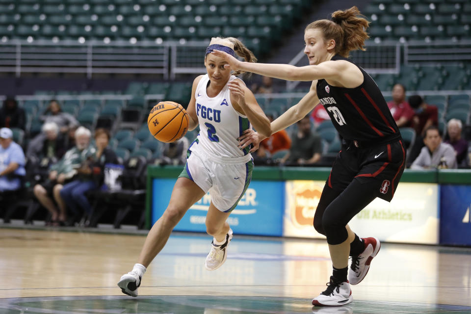 Florida Gulf Coast guard Sophia Stiles (2) dribbles past Stanford guard Elena Bosgana (20) during the fourth quarter of an NCAA college basketball game Friday, Nov. 25, 2022, in Honolulu. (AP Photo/Marco Garcia)