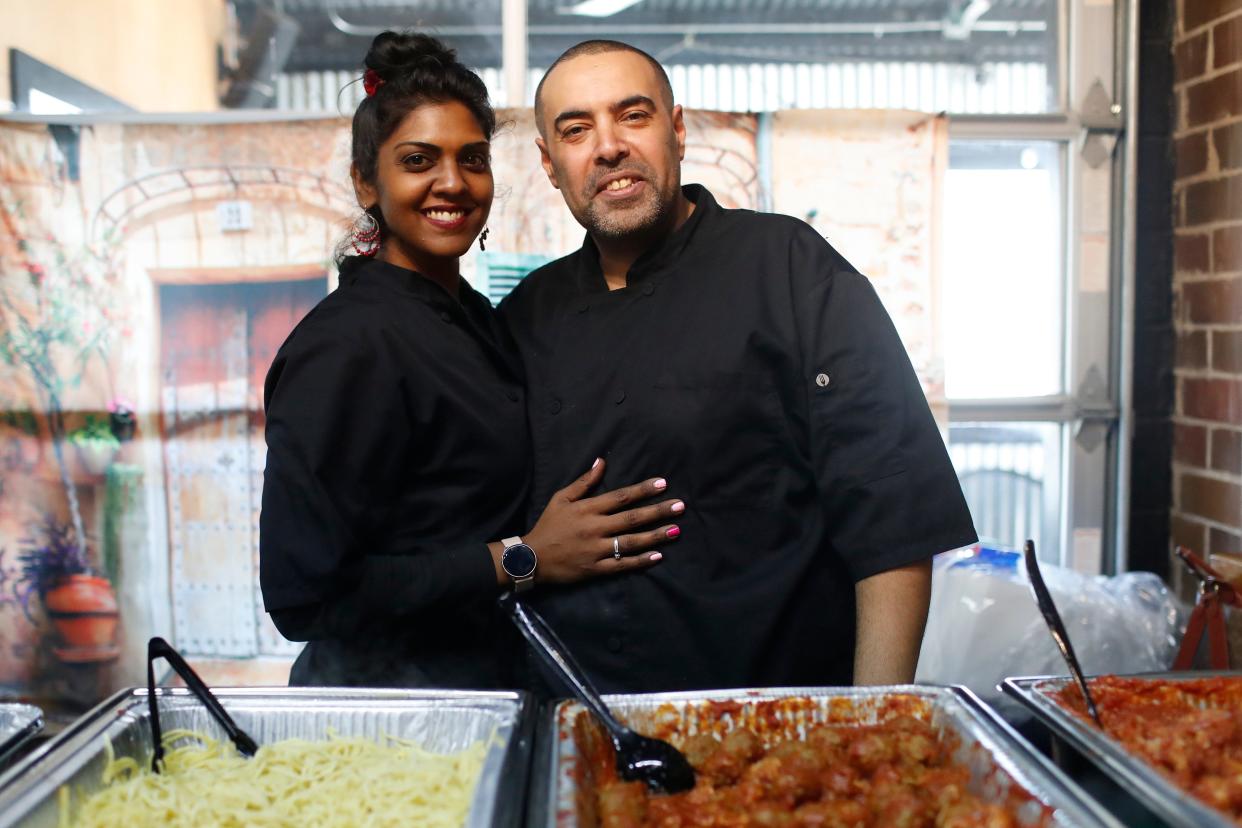 Kat and Felix Ahmed, owners of Basket Catering, pose for a photo during the first Taste of the World Lunches at Athentic Brewing Co. in Athens, Ga., on Friday, Feb. 2, 2024. Taste of the World Lunches will be held every Friday at Athentic with next week featuring Egyptian food and Trinidad and Southern food in the fallowing weeks.