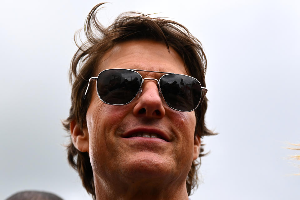 <p>NORTHAMPTON, ENGLAND - JULY 03: Tom Cruise walks in the Paddock prior to the F1 Grand Prix of Great Britain at Silverstone on July 03, 2022 in Northampton, England. (Photo by Clive Mason/Getty Images)</p> 