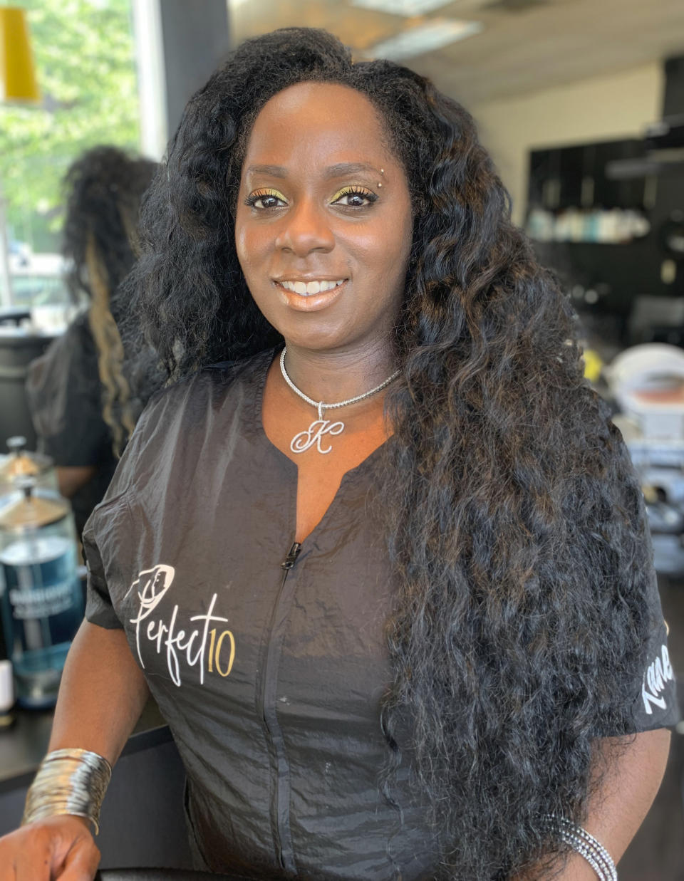 This image provided by Isis Alexander shows cosmetologist Kanessa Alexander. After repeatedly being denied service by high-end salons because her hair was perceived as too difficult to style, Alexander opened a shop of her own in a predominantly white Boston neighborhood with four Black stylists serving all hair textures. Alexander and more than a dozen other people of color in the industry trace such bias and discrimination in predominantly white salons to the sidelining of formal education focused on Black hair. Horror stories are not uncommon, from outright refusal of service to botched treatments and cuts by stylists who don't know what they're doing. (Isis Alexander via AP)