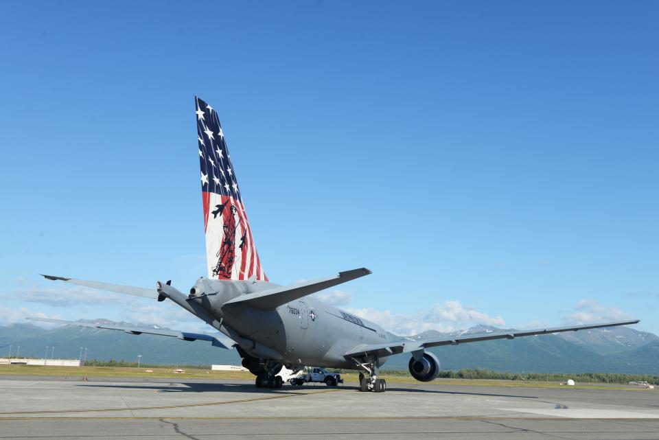 The Spirit of Portsmouth, a KC-46A assigned to the 157th Air Refueling Wing, sits in the evening sunlight on the ramp at Joint Base Elmondorf-Richardson in Alaska. The plane was in Alaska to receive its patriotic new paint job at the 176th Wing's 36,000-square-foot paint booth, one of the largest in the Department of Defense.