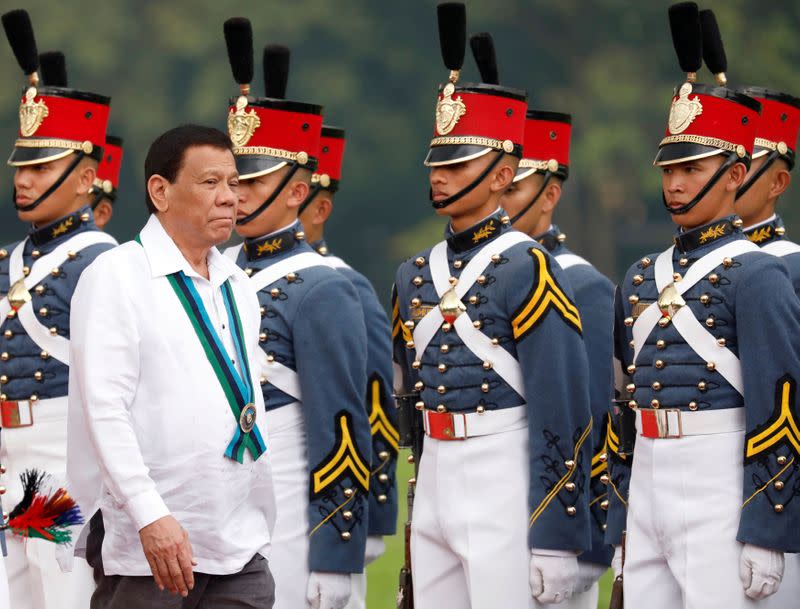 FILE PHOTO: Philippines President Rodrigo Duterte reviews military cadets during change of command ceremonies of the Armed Forces of the Philippines (AFP) at Camp Aguinaldo in Quezon City, metro Manila