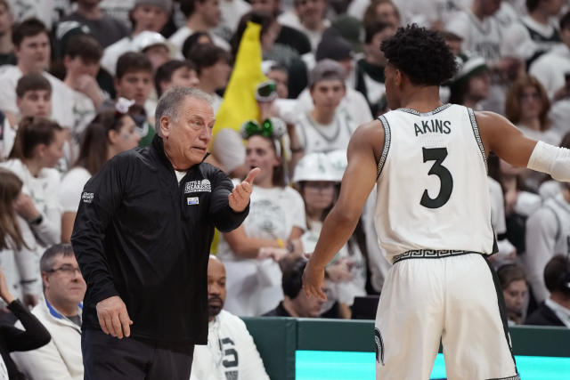 Michigan State head coach Tom Izzo talks to guard Jaden Akins during the first half of an NCAA college basketball game against Iowa, Thursday, Jan. 26, 2023, in East Lansing, Mich. (AP Photo/Carlos Osorio)