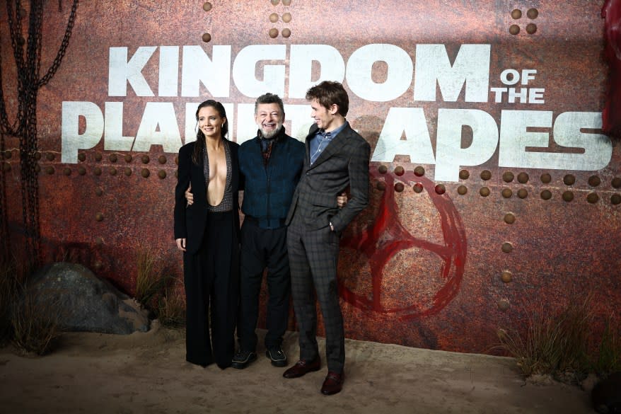 English actors Freya Allan, Andy Serkis and US actor Owen Teague posing on the red carpet at the UK preview of 'Kingdom of the Planet of the Apes'