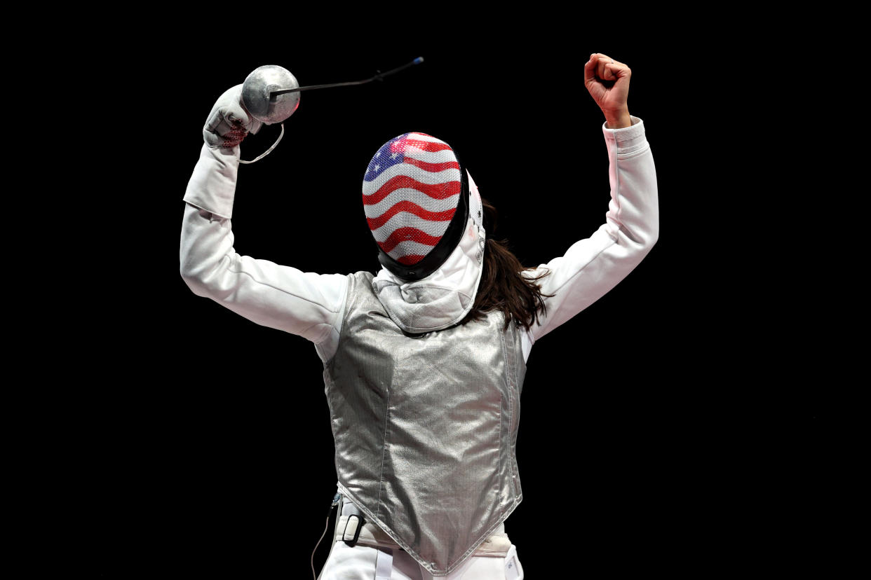 Lee Kiefer celebrates the first individual foil Olympic gold medal in American history. (Elsa/Getty Images)