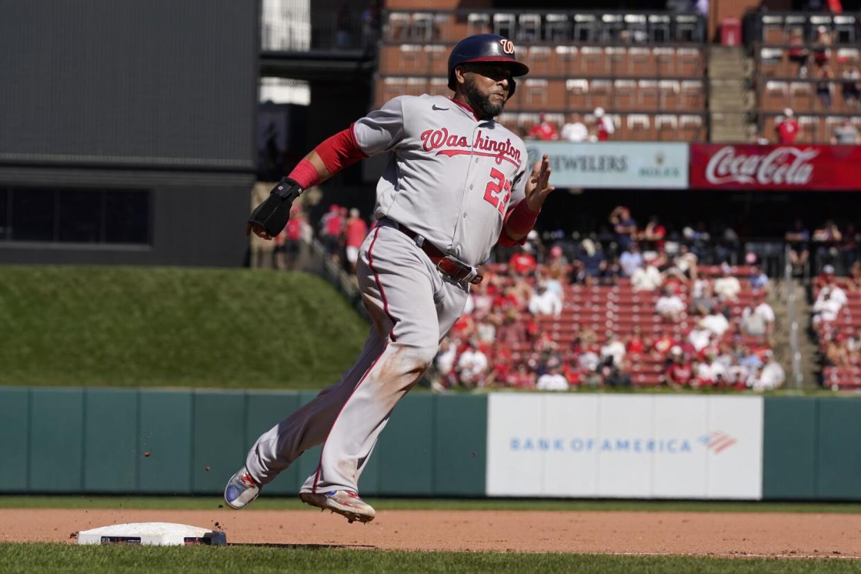 Washington Nationals' Nelson Cruz scores against the St. Louis Cardinals on Sept. 8, 2022.