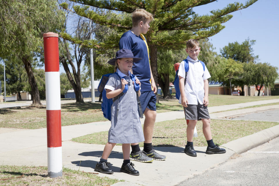 School children crossing the road.