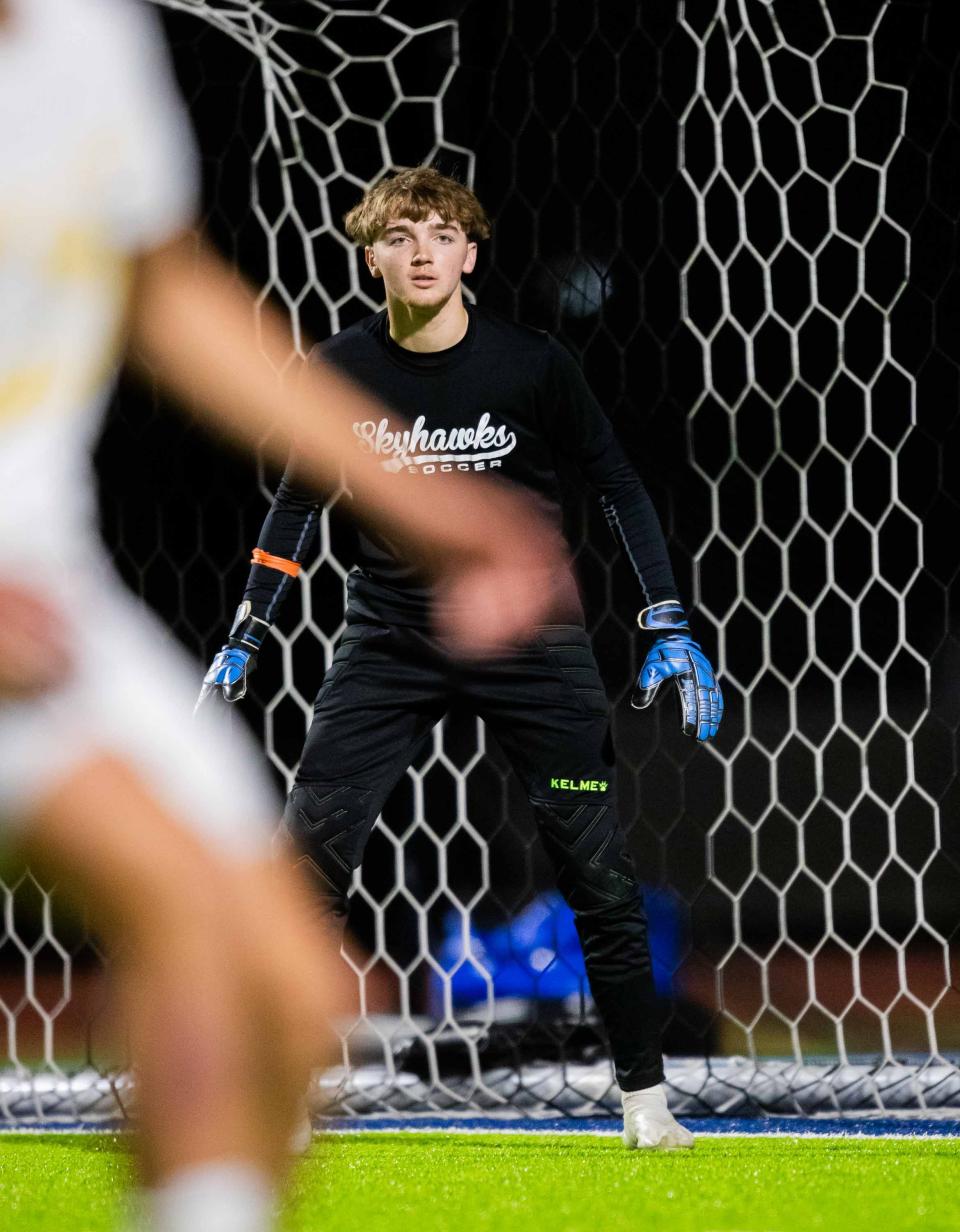 Deer Valley Skyhawks goalie Gibson Ulrich (9) prepares to block the ball against the Barry Goldwater Bulldogs at Deer Valley High School's soccer field in Glendale on Jan. 29, 2024.