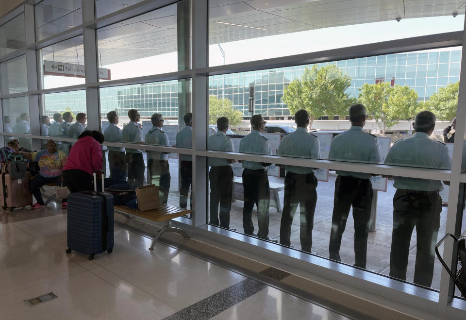 Southwest Airlines pilots picket outside the terminal at Dallas Love Field on Tuesday, June 21, 2022, in Dallas. (AP Photo/David Koenig)