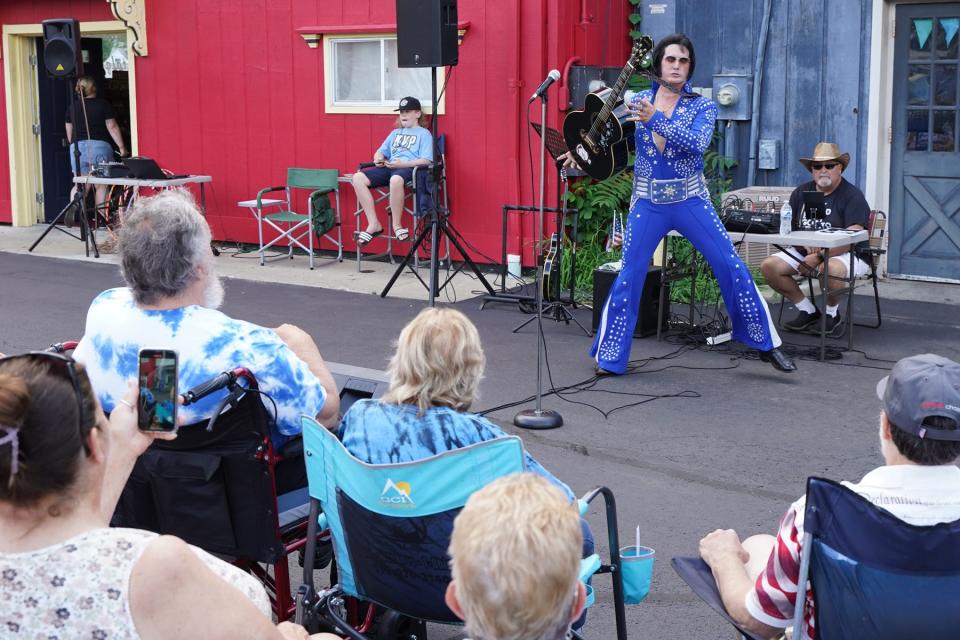 Thirty-year Elvis Presley impersonator Matt King entertained a large crowd of guests Tuesday, Aug. 9, 2022, in the East Church Street parking lot at Nova's Soda Pop Candy Shop in downtown Adrian. King's performance as the "King of Rock and Roll" was a part of Nova's 20th anniversary celebration and its monthly Tuesday at Nova's community event.