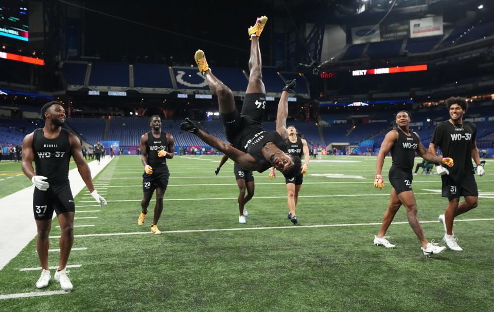 Mar 2, 2024; Indianapolis, IN, USA; Southern California wide receiver Tahj Washington (WO34) celebrates with a backflip during the 2024 NFL Combine at Lucas Oil Stadium. Mandatory Credit: Kirby Lee-USA TODAY Sports
