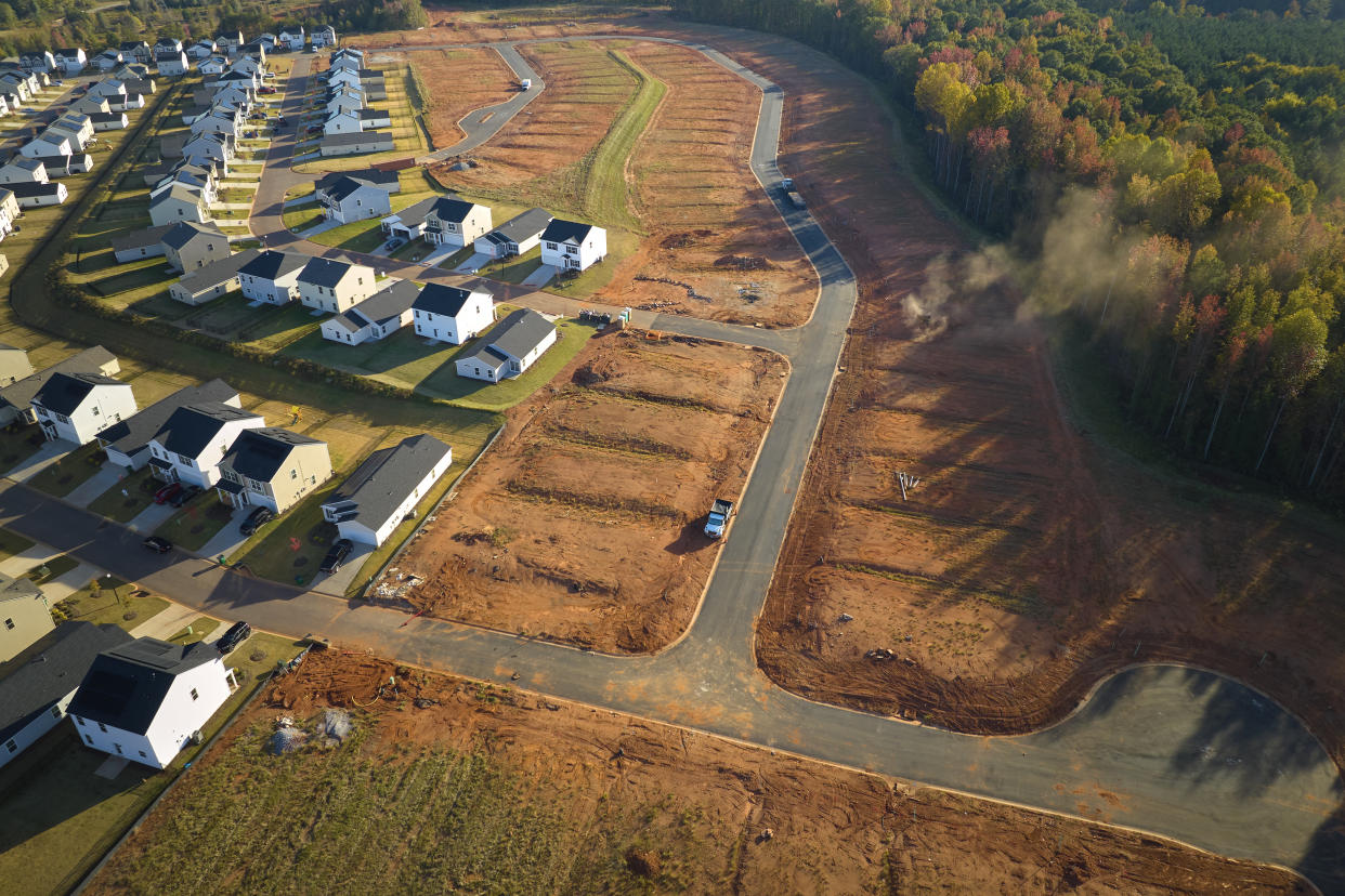 Real estate development with tightly located family houses under construction in South Carolina suburban area. Concept of growing american suburbs.