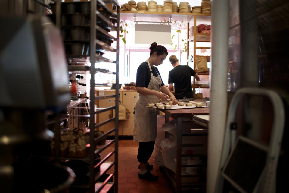 job Members of staff work in the Sourdough Sophia bakery in London, Wednesday, Sept. 21, 2022. At the store, in the Crouch End neighbourhood of north London, the electricity bill has more than tripled since the start of the year according to owner Sophia Sutton-Jones, to roughly 5,500 pounds ($6,260) a month, up from 1,500 in January – a crushing increase that's making life difficult for the independent business. The bakery's woes underscore how energy price spikes are threatening companies, alongside a cost of living crisis afflicting Britain and much of Europe. (AP Photo/David Cliff)