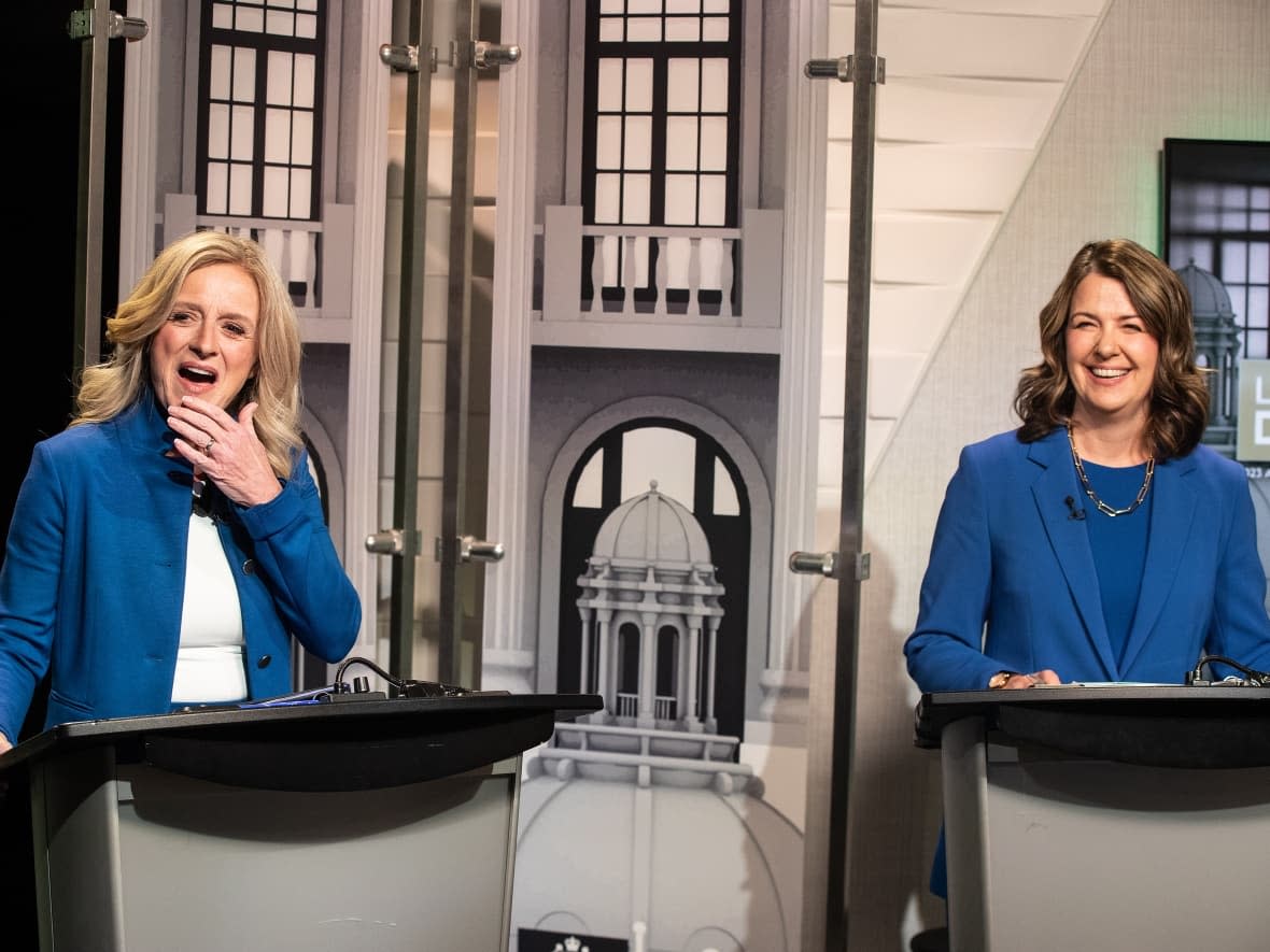 NDP Leader Rachel Notley, left, and United Conservative Party Leader Danielle Smith prepare for a debate in Edmonton on May 18, 2023. (Jason Franson/The Canadian Press - image credit)