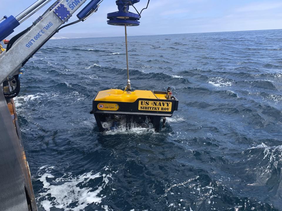 FILE - In this Monday, Aug. 3, 2020, file photo, provided by the U.S. Navy, Undersea Rescue Command deploys the Sibitzky Remotely Operated Vehicle from the deck of the Military Sealift Command-chartered merchant vessel HOS Dominator off the coast of Southern California. Authorities on Friday, Aug. 7, 2020, recovered the bodies of nine people killed when a Marine landing craft sank in hundreds of feet of water on July 30 off the Southern California coast, officials said. (Lt. Curtis Khol/U.S. Navy via AP, File)