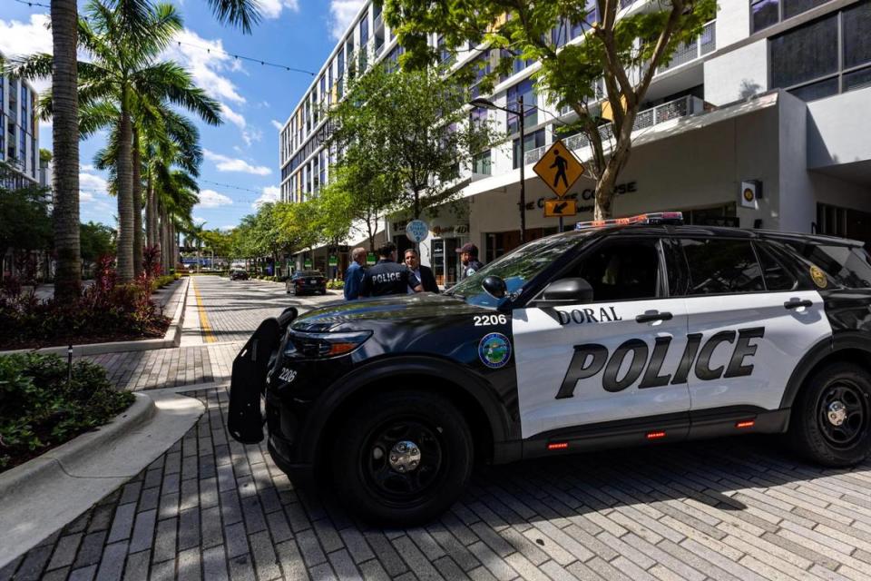 Police cruisers are stationed before the round about inside CityPlace Doral on Saturday, April 6, 2024. A gunman was shot dead and eight others injured — including an Army-trained Doral police officer who wrapped a tourniquet around his injured upper thigh — in a shootout involving police at a Doral nightclub early Saturday morning.