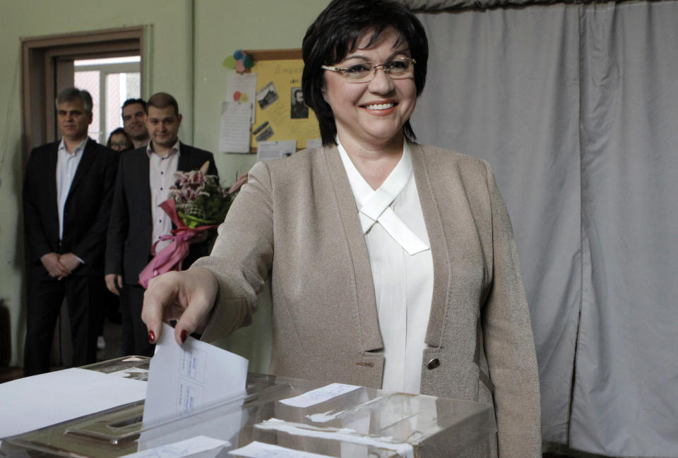 Bulgarian Socialists' Party leader Kornelia Ninova smiles as she casts her vote in Sofia on Sunday, March 26, 2017. Bulgarians are heading to the polls for the third time in four years in a snap vote that could tilt the European Union's poorest member country closer to Russia as surveys put the GERB party neck-and-neck with the Socialist Party. (AP Photo/Valentina Petrova)