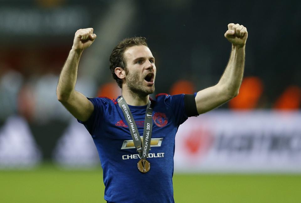 Juan Mata celebrates the win