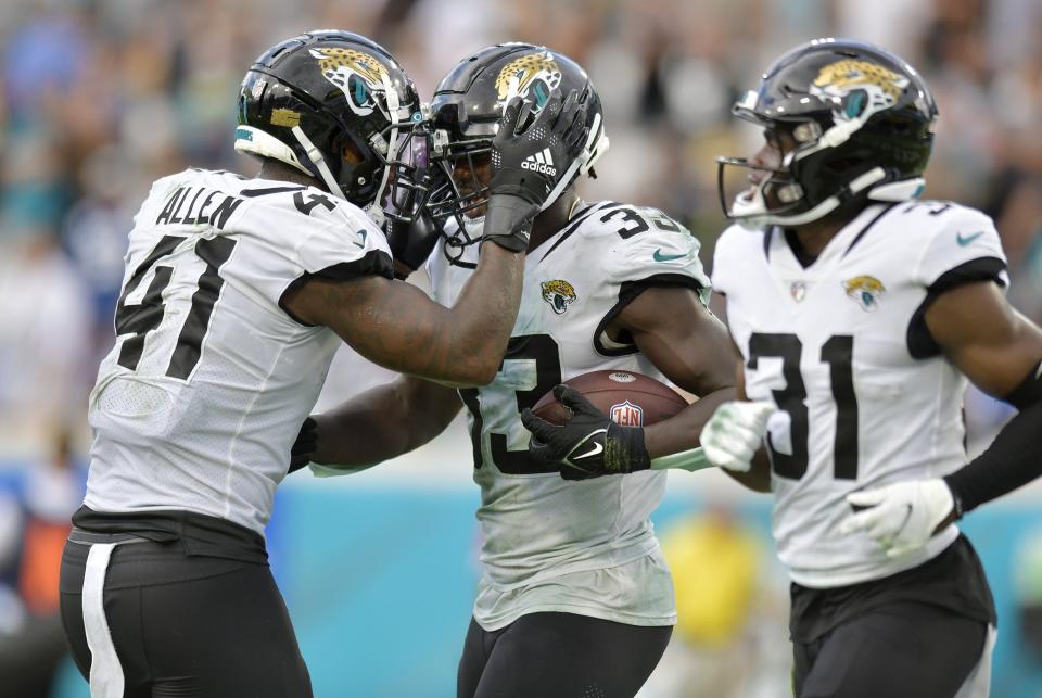 Jacksonville Jaguars linebacker Josh Allen (41) congratulates teammate linebacker Devin Lloyd (33) after his late fourth quarter interception of a Colts pass. The Jaguars went into the first half with a 17 to 0 lead over the Colts and went on to win the game 24 to 0. The Jacksonville Jaguars hosted the Indianapolis Colts at TIAA Bank field in Jacksonville, FL Sunday, September 18, 2022. [Bob Self/Florida Times-Union]