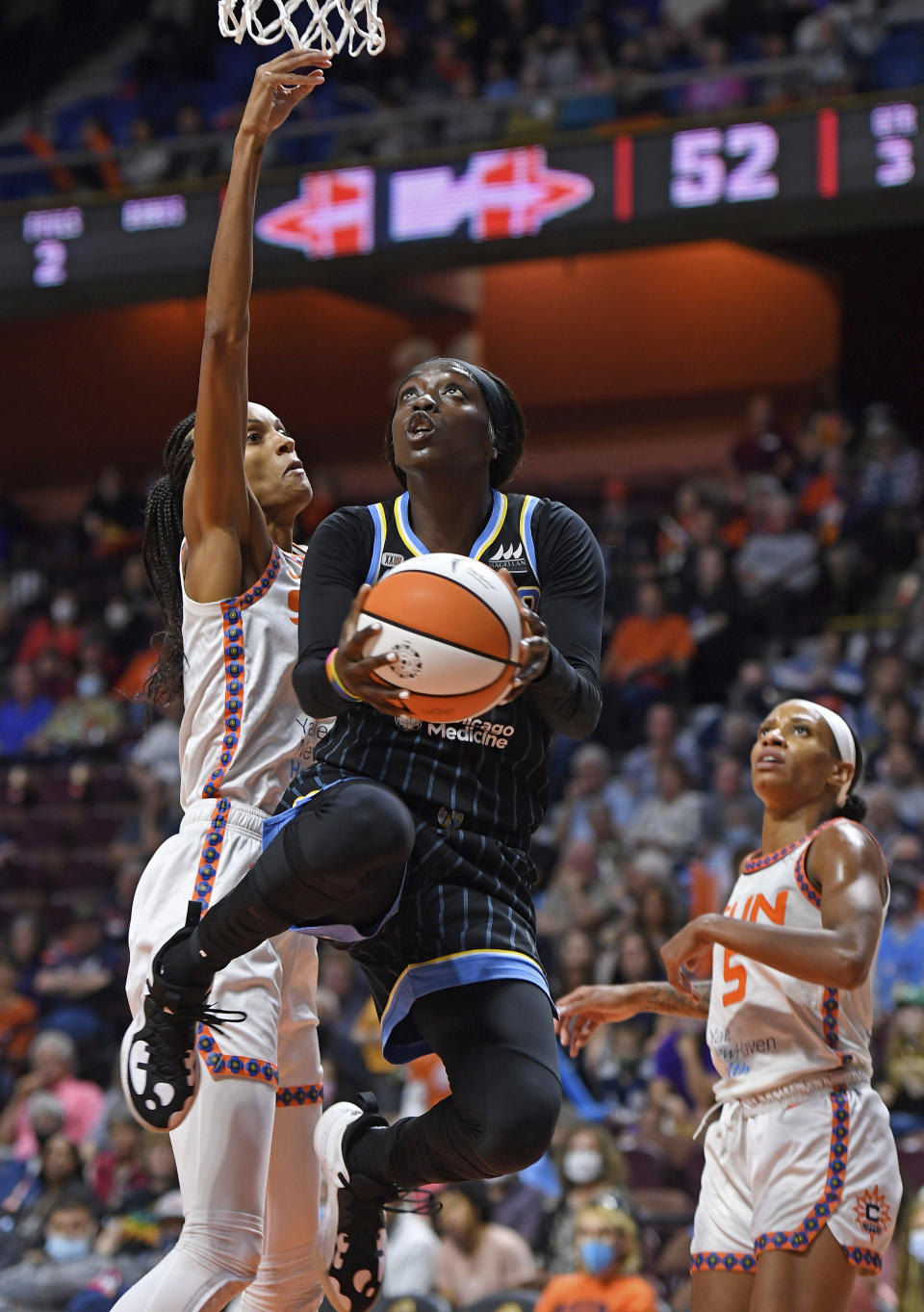 Chicago Sky guard Kahleah Copper drives to the basket as Connecticut Sun forward DeWanna Bonner defends defends during a WNBA semifinal playoff basketball game, Tuesday, Sept. 28, 2021, at Mohegan Sun Arena in Uncasville, Conn. (Sean D. Elliot/The Day via AP)