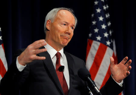 FILE PHOTO: Former Rep. Asa Hutchinson (R-AR), a consultant of the National Rifle Association, discusses the findings and recommendations of the National School Shield Program at the National Press Club in Washington, DC, U.S. on April 2, 2013. REUTERS/Gary Cameron/File Photo