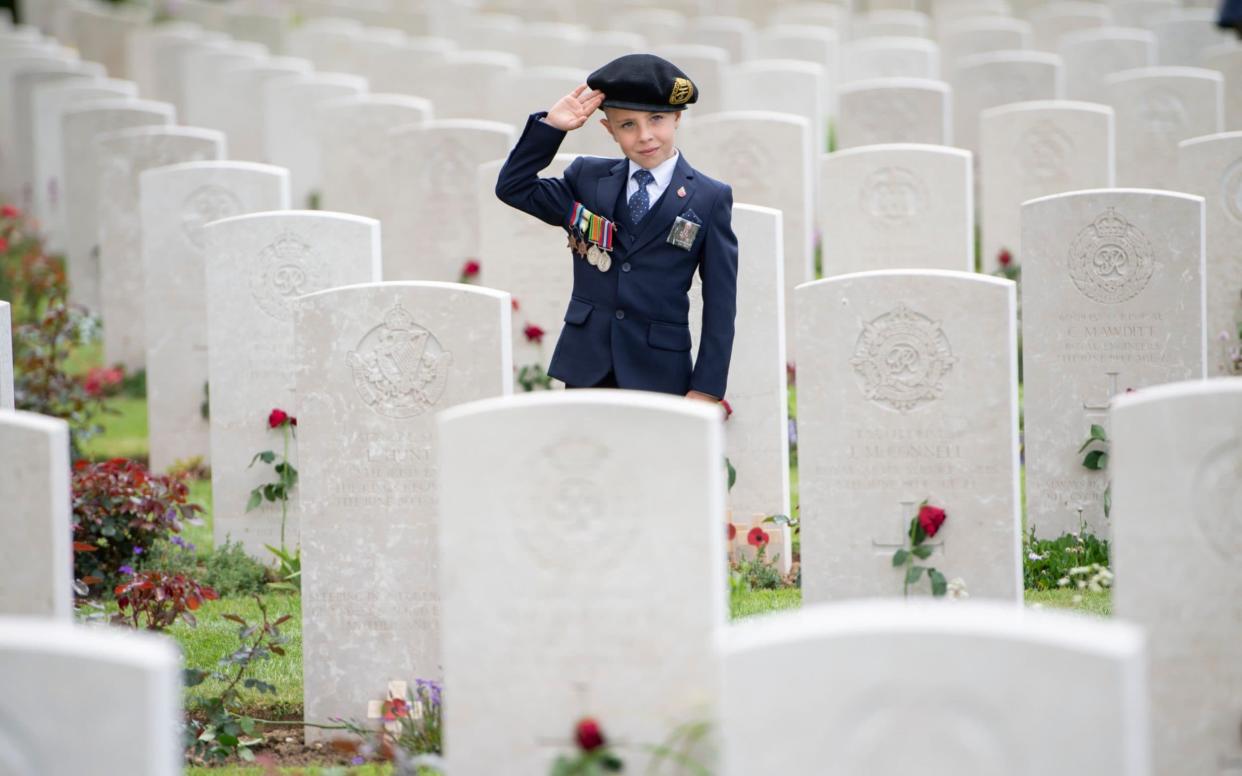 Six-year-old George Sayer paying tribute to his great uncle, who landed on Sword Beach on D-Day - Paul Grover FOR THE TELEGRAPH