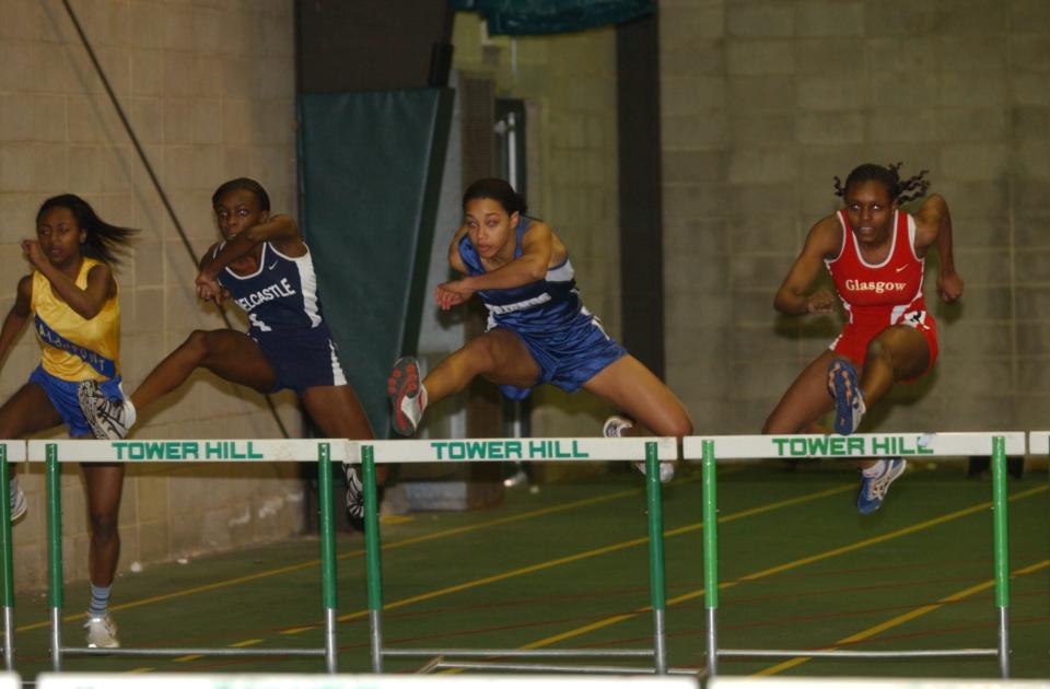 First place finisher Jernail Hayes of Glasgow (right) and second place finisher Alexandra Coppadge of Wilmington Friends compete in the 55m hurdles at the N5CTA indoor track meet Saturday, Feb. 19, 2005 at Tower Hill.