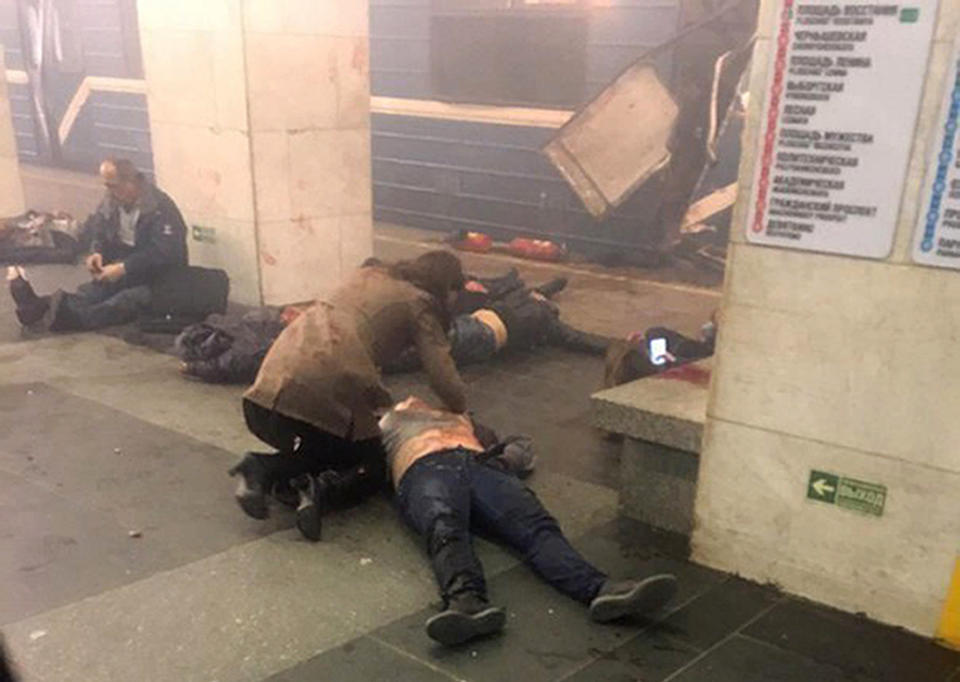 Blast victims lie near a subway train hit by a explosion at the Tekhnologichesky Institut subway station in St.Petersburg, Russia, Monday, April 3, 2017. The subway in the Russian city of St. Petersburg is reporting that several people have been injured in an explosion on a subway train. (AP Photo/www.vk.com/spb_today via AP)