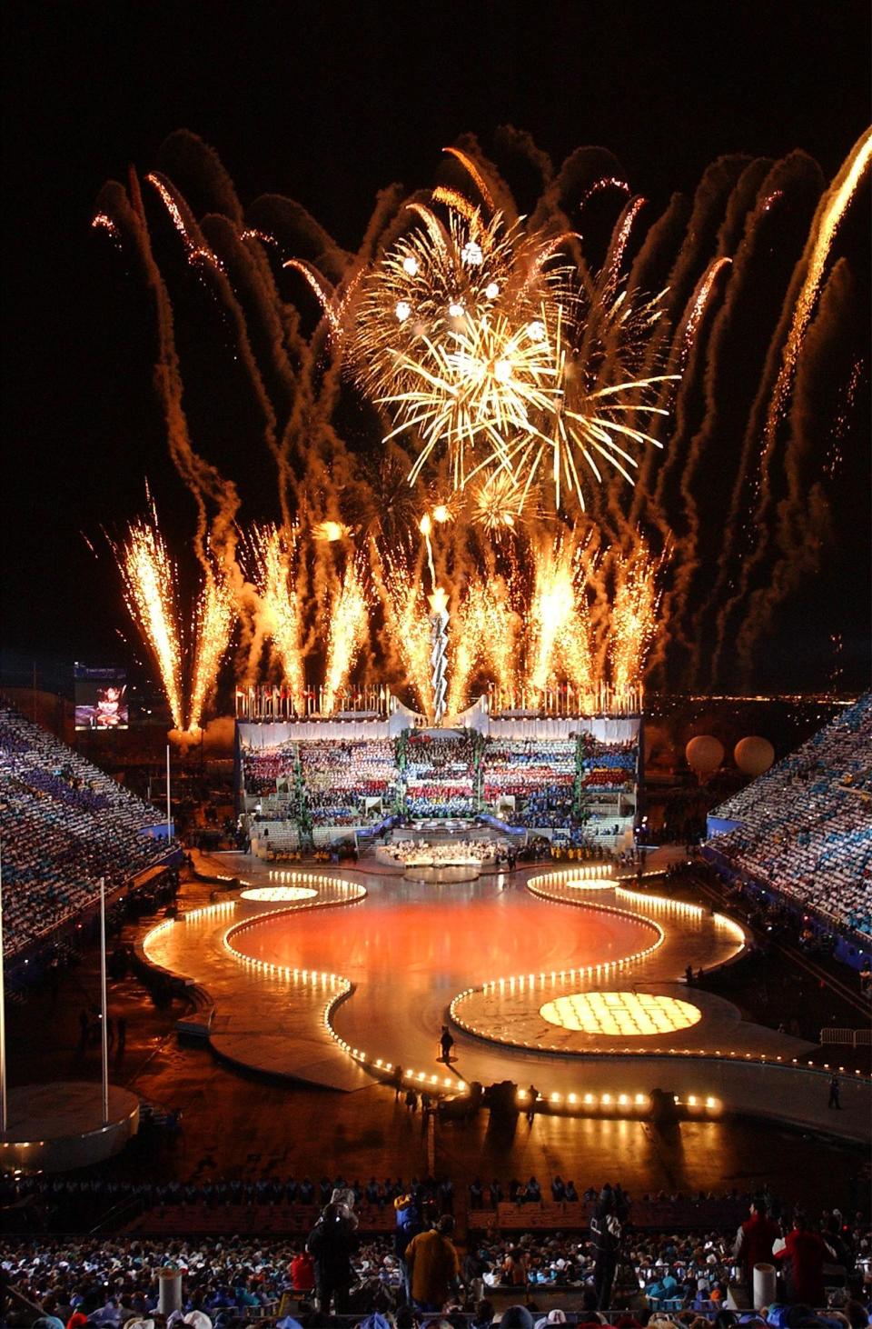 Fireworks explode during the 2002 Winter Games closing ceremony on Sunday, Feb 24, 2002, at the University of Utah’s Rice-Eccles Stadium. | Scott G Winterton, Deseret News