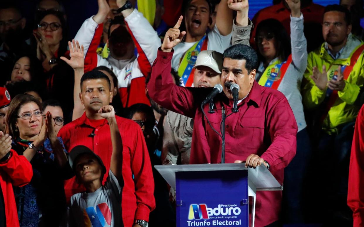 Venezuela's President Maduro stands with supporters after the results of the election were released - REUTERS