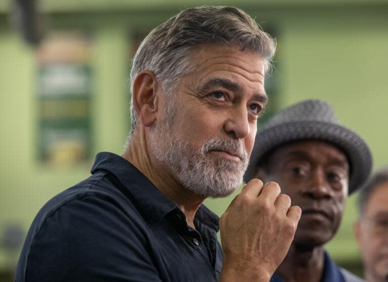 LOS ANGELES, CA-OCTOBER 13, 2023:George Clooney, left, actor and founder of the Roybal School of Film and Television Production Magnet in downtown Los Angeles, and Don Cheadle, actor and Royal Advisory Board Member, talk to the media during a celebration of the launch of the 2nd year of the Magnet School. (Mel Melcon/Los Angeles Times)