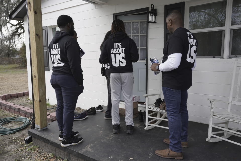 We Fight Back campaign activists canvas the Liberty Hill neighborhood to encourage residents to vote in elections, on Saturday, Jan. 27, 2024, in North Charleston, South Carolina. (AP Photo/Serkan Gurbuz)