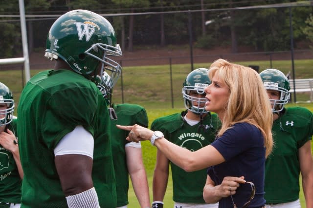 THE BLIND SIDE, foreground from left: Quinton Aaron, Sandra Bullock, 2009. 