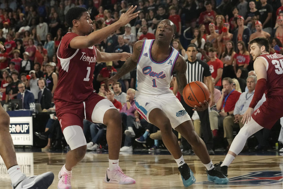 Florida Atlantic guard Johnell Davis (1) dribbles the ball as Temple guard Zion Stanford (1) defends during the first half of an NCAA college basketball game, Thursday, Feb. 15, 2024, in Boca Raton, Fla. (AP Photo/Marta Lavandier)