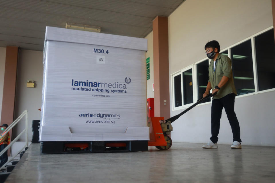 In this photo released by Siam Bioscience, a worker loads AstraZeneca COVID-19 vaccines produced by Siam Bioscience from its factory in Nonthaburi province, Thailand, Wednesday, June 2, 2021. AstraZeneca's partner in Thailand on Wednesday began its first deliveries of COVID-19 vaccines after concerns they were behind on their production schedules for the country and parts of Southeast Asia. (Siam Bioscience via AP)