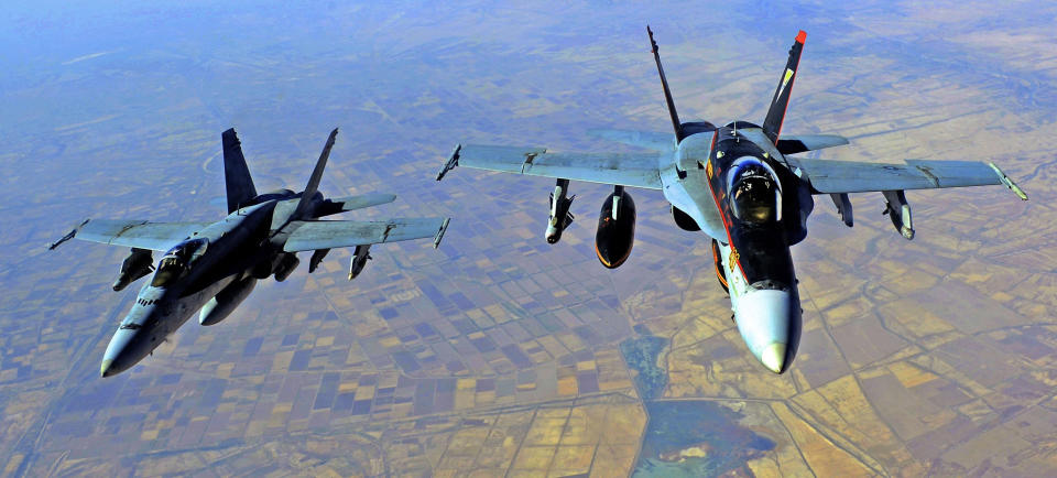 Image: Two U.S. Navy Super Hornets are seen being refueled over Iraq in 2014. (AFP - Getty Images file)